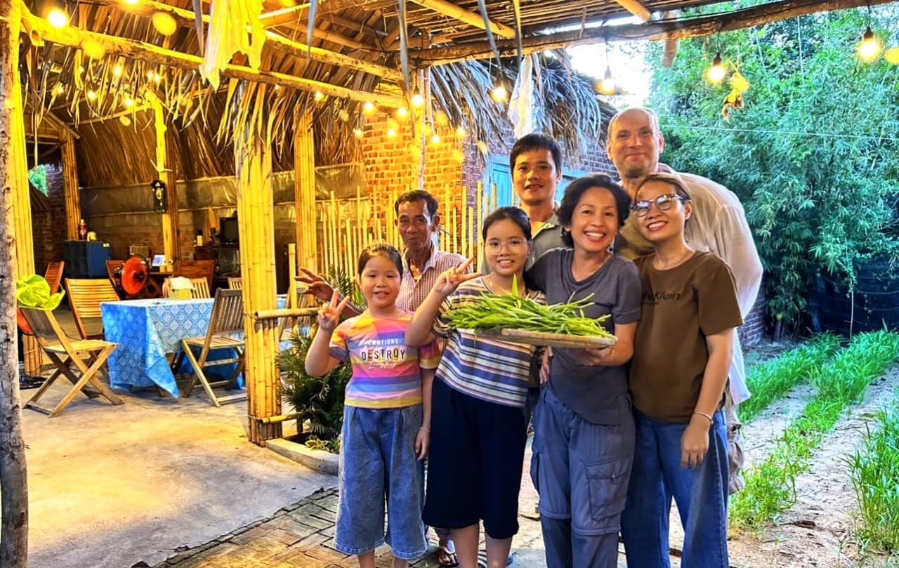 Bong and her family with fresh greens from the garden
